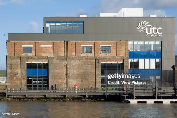 Elevation across harbour towards main facade. UTC Newhaven, Newhaven, United Kingdom. Architect: HKS Architects Limited, 2016.