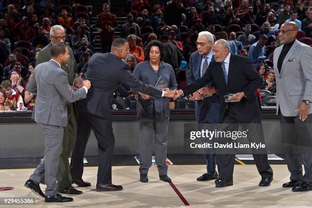Bernie Bickerstaff, Wayne Embry, and Families of Nathaniel Clifton, Earl Lloyd and Chuck Cooper are honored during the game between the Cleveland...