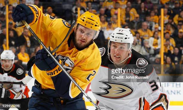 Anthony Bitetto of the Nashville Predators battles against Nick Ritchie of the Anaheim Ducks during an NHL game at Bridgestone Arena on March 8, 2018...