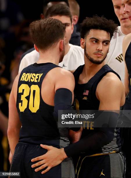 Markus Howard of the Marquette Golden Eagles consoles Andrew Rowsey after the loss to the Villanova Wildcats during quarterfinals of the Big East...