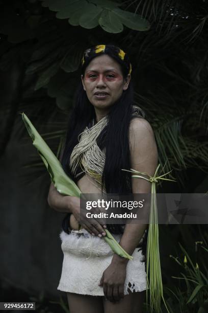 Weya Cahuila from Waorani tribe of Amazonian attends a ceremony to commemorate the International Day of Women in Puyo, Ecuador on March 8, 2018.