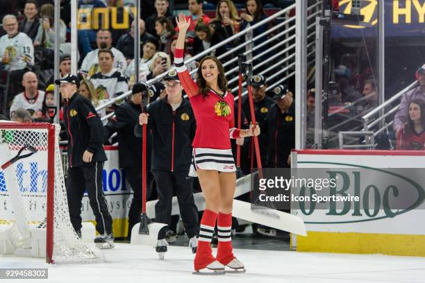 Chicago Blackhawks Ice Crew member waves to fans in the 1st period during an NHL hockey game between the Carolina Hurricanes and the Chicago...