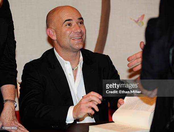 Former tennis player Andre Agassi signs copies of his new autobiography, "Open" at the Encore Theater at Wynn Las Vegas November 9, 2009 in Las...