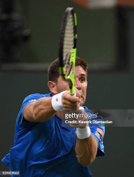 Frederico Delbonis, of Argentina, returns against Ryan Harrison, of United States, during Day 4 of the BNP Paribas Open on March 8, 2018 in Indian...