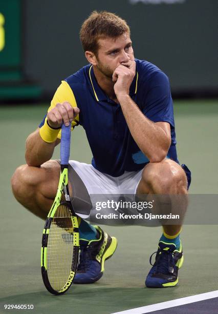 Ryan Harrison, of United States, reacts during his first round match against Frederico Delbonis, of Argentina, during Day 4 of the BNP Paribas Open...