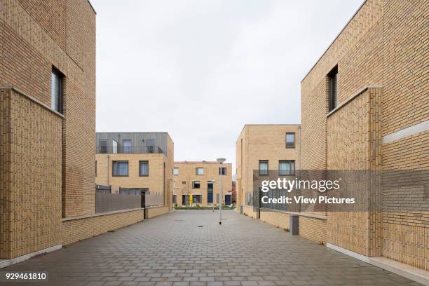 Elevational street-view looking towards Bart van der Leckplantsoen. Middengebied Noord Overtoomse Veld residences, Amsterdam, Netherlands. Architect:...