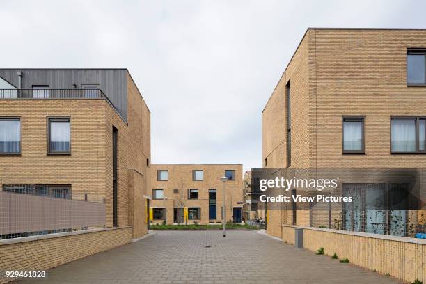 Elevational street-view looking towards Bart van der Leckplantsoen. Middengebied Noord Overtoomse Veld residences, Amsterdam, Netherlands. Architect:...