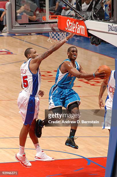 Chris Paul of the New Orleans Hornets puts up a shot against Rasual Butler of the Los Angeles Clippers at Staples Center on November 9, 2009 in Los...