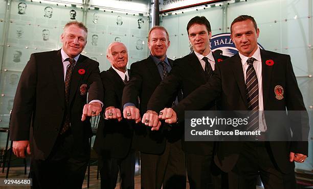 Brett Hull, Lou Lamoriello, Brian Leetch, Luc Robitaille, and Steve Yzerman pose with their Hall rings at the Hockey Hall of Fame Induction Photo...