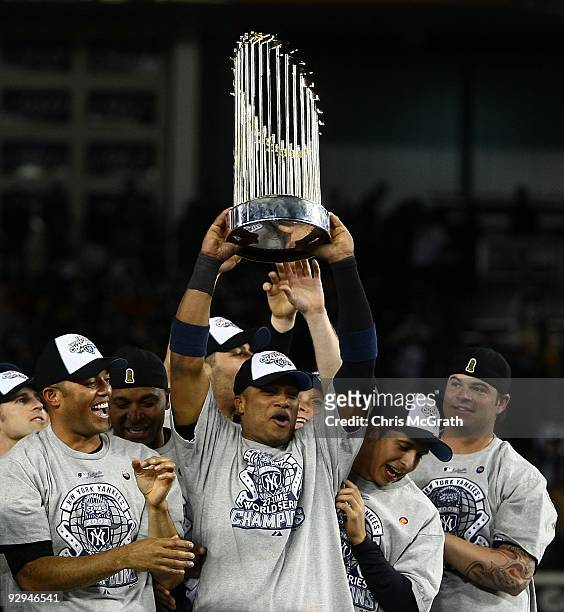 Robinson Cano of the New York Yankees celebrates with the trophy after their 7-3 win against the Philadelphia Phillies in Game Six of the 2009 MLB...
