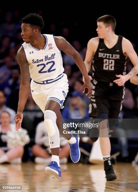 Myles Cale of the Seton Hall Pirates celebrates his three point shot as Sean McDermott of the Butler Bulldogs defends during quarterfinals of the Big...