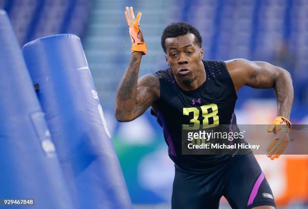 Louisiana State defensive lineman Arden Key participates in a drill during the NFL Scouting Combine at Lucas Oil Stadium on March , 2018 in...