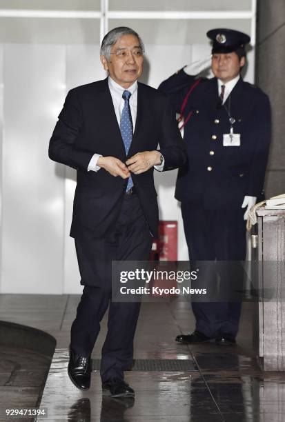 Bank of Japan Governor Haruhiko Kuroda arrives at the central bank's head office in Tokyo to attend a monetary policy meeting on March 9, 2018....