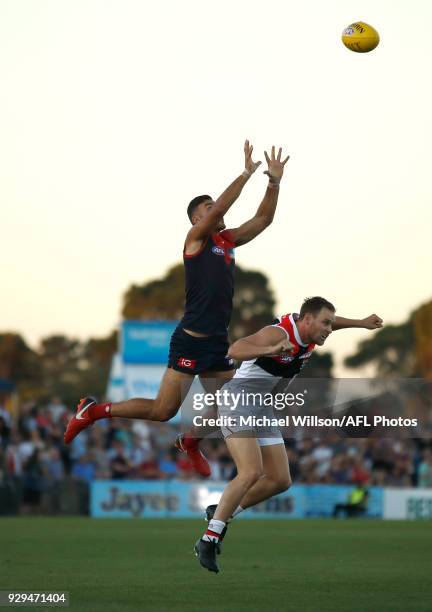 Christian Salem of the Demons and David Armitage of the Saints compete for the ball during the AFL 2018 JLT Community Series match between the...