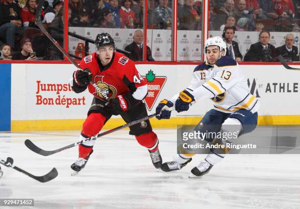 Jean-Gabriel Pageau of the Ottawa Senators skates against Nicholas Baptiste of the Buffalo Sabres at Canadian Tire Centre on March 8, 2018 in Ottawa,...