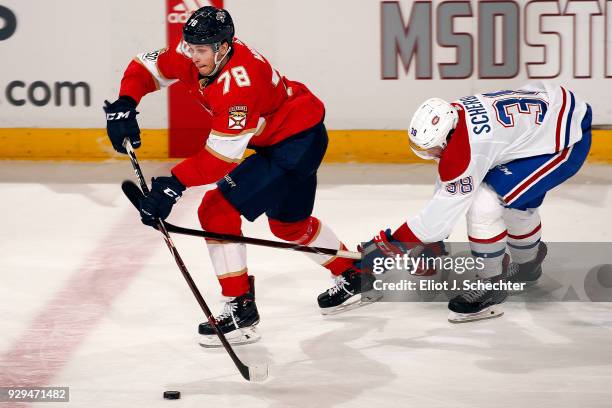 Maxim Mamin of the Florida Panthers skates with the puck against Nikita Scherbak of the Montreal Canadiens at the BB&T Center on March 8, 2018 in...