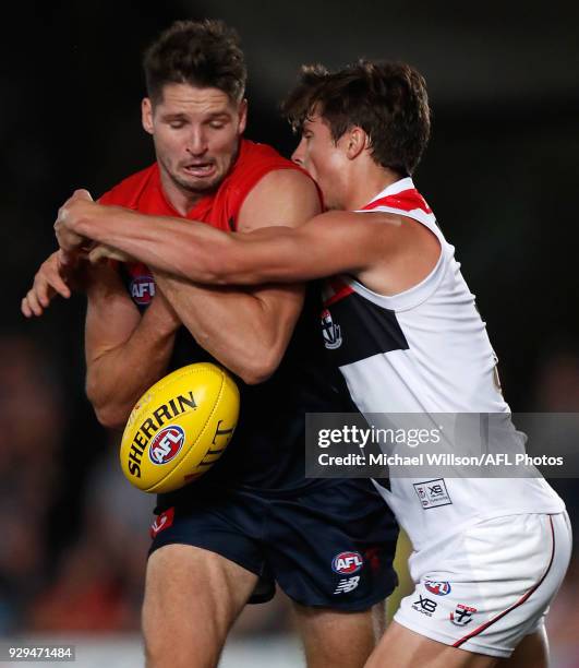 Jesse Hogan of the Demons is tackled by Jack Steele of the Saints during the AFL 2018 JLT Community Series match between the Melbourne Demons and the...