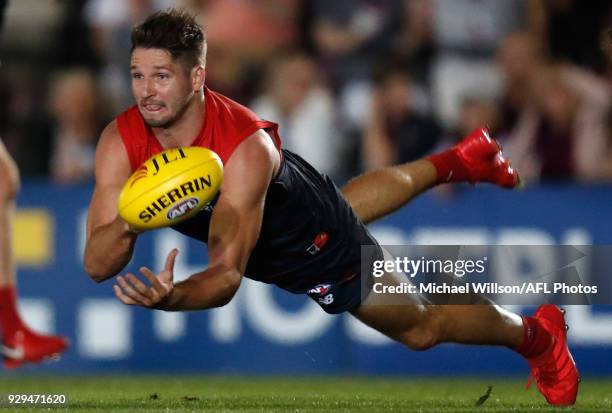 Jesse Hogan of the Demons handpasses the ball during the AFL 2018 JLT Community Series match between the Melbourne Demons and the St Kilda Saints at...