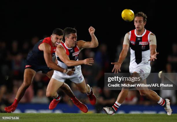 Jade Gresham of the Saints is tackled by Christian Petracca of the Demons during the AFL 2018 JLT Community Series match between the Melbourne Demons...