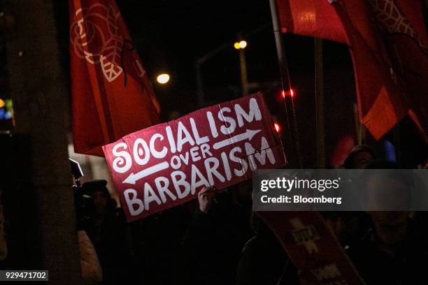 Demonstrator holds a sign during the International Women's Strike NYC rally in New York, U.S., on Thursday, March 8, 2018. The United Nations first...