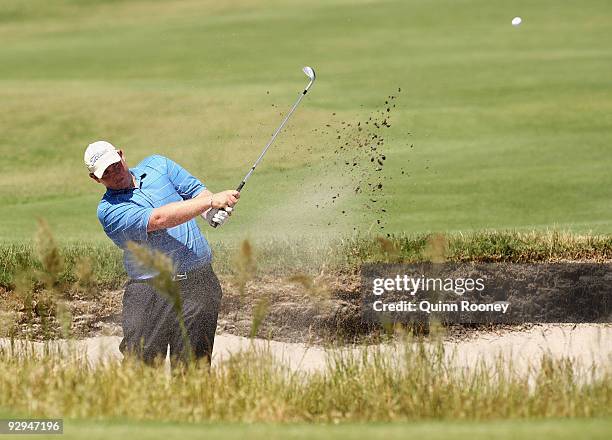 Jarrod Lyle of Australia plays out of a bunker on the 16th hole during a practice round ahead of the 2009 Australian Masters at Kingston Heath Golf...