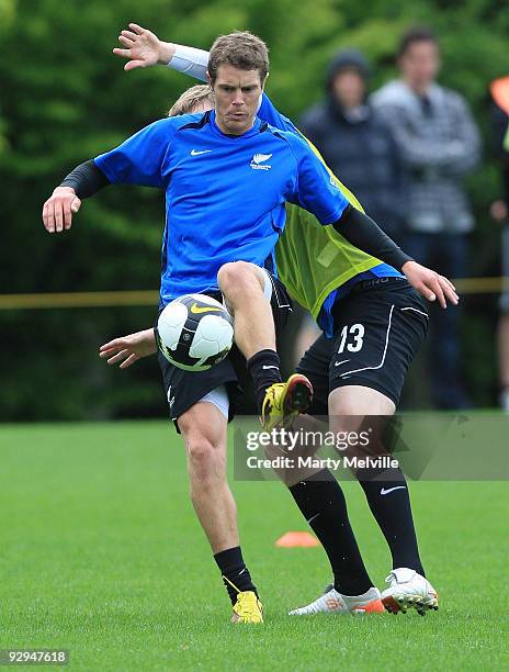 Tony Lochead of the All Whites gets tackled by team mate Chris Wood during a New Zealand All Whites training at Endeavour Park on November 10, 2009...