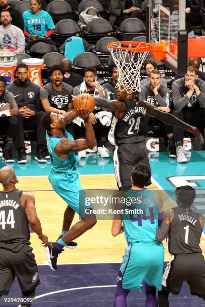 Treveon Graham of the Charlotte Hornets goes to the basket against the Brooklyn Nets on March 8, 2018 at Spectrum Center in Charlotte, North...