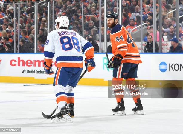 Zack Kassian of the Edmonton Oilers exchanges words with Brandon Davidson of the New York Islanders on March 8, 2018 at Rogers Place in Edmonton,...