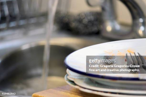 untidy house -dirty dishes at sink. - gregoria gregoriou crowe fine art and creative photography stock pictures, royalty-free photos & images