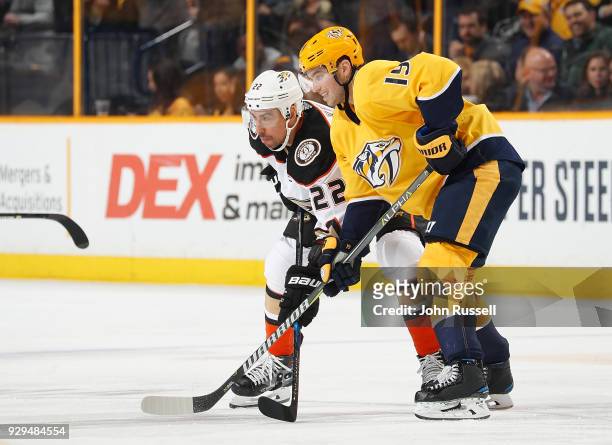Calle Jarnkrok of the Nashville Predators skates against Chris Kelly of the Anaheim Ducks during an NHL game at Bridgestone Arena on March 8, 2018 in...