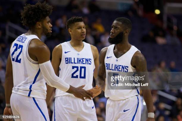 Hasahn French, Jalen Johnson, and Davell Roby of the Saint Louis Billikens celebrate against the George Washington Colonials in the second round of...