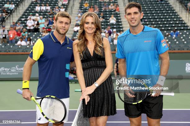 Daniela Hantuchova of Slovakia poses with Ryan Harrison plays Federico Delbonis of Argentina after performing the coing toss during the BNP Paribas...