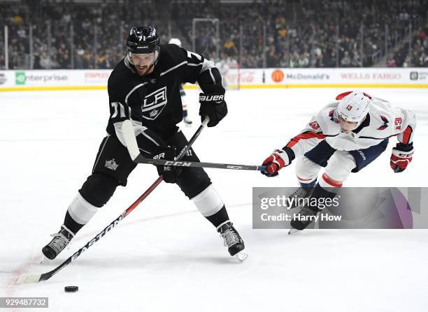 Torrey Mitchell of the Los Angeles Kings is checked by Jakub Vrana of the Washington Capitals during the first period at Staples Center on March 8,...