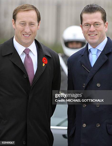 German Defence Minister Karl-Theodor zu Guttenberg and Canadian counterpart Peter MacKay pose for photographers after inspecting an honour guard at...