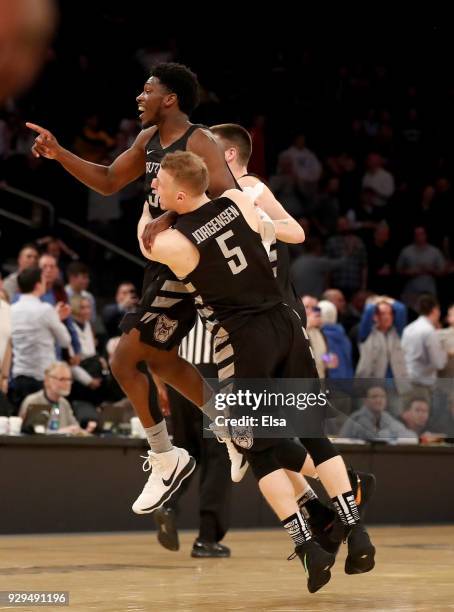 Kamar Baldwin,Paul Jorgensen and Nate Fowler of the Butler Bulldogs celebrate the win over the against the Seton Hall Pirates during quarterfinals of...