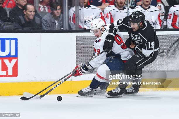 Dmitry Orlov of the Washington Capitals battles for the puck against Alex Iafallo of the Los Angeles Kings at STAPLES Center on March 8, 2018 in Los...