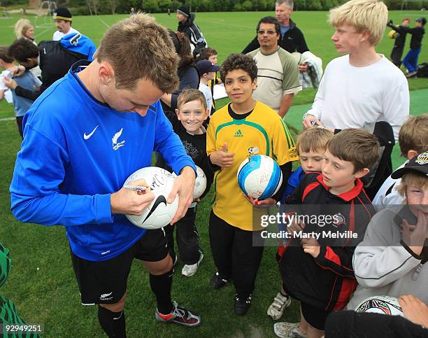 Shane Smeltz of the All Whites signs autographs during a New Zealand All Whites training at Endeavour Park on November 10, 2009 in Wellington, New...