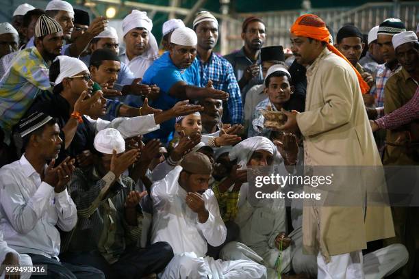 Ajmer Sharif dargah, Rajasthan. Faithful receiving blessed sweets. India.