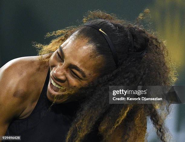 Serena Williams laughs during her match against Zarina Diyas, of Kazakhstan, during Day 4 of the BNP Paribas Open on March 8, 2018 in Indian Wells,...