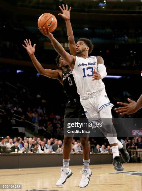 Myles Powell of the Seton Hall Pirates heads for the net as Kamar Baldwin of the Butler Bulldogs defends in the second half during quarterfinals of...