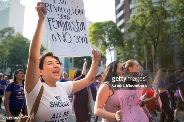 Demonstrators hold signs during a national strike on International Women's Day in Mexico City, Mexico, on Thursday, March 8, 2018. The United Nations...