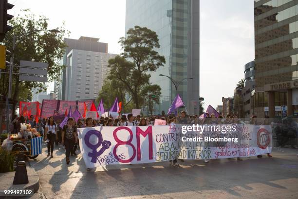 Demonstrators hold signs and banners during a national strike on International Women's Day in Mexico City, Mexico, on Thursday, March 8, 2018. The...