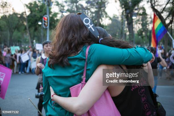 Demonstrators hug during a national strike on International Women's Day in Mexico City, Mexico, on Thursday, March 8, 2018. The United Nations first...