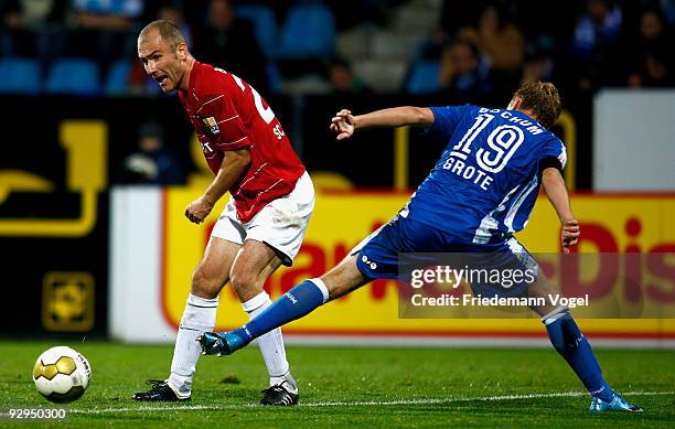 Ivica Banovic of Freiburg in action with Dennis Grote of Bochum during the Bundesliga match between VfL Bochum and SC Freiburg at the Rewirpower...