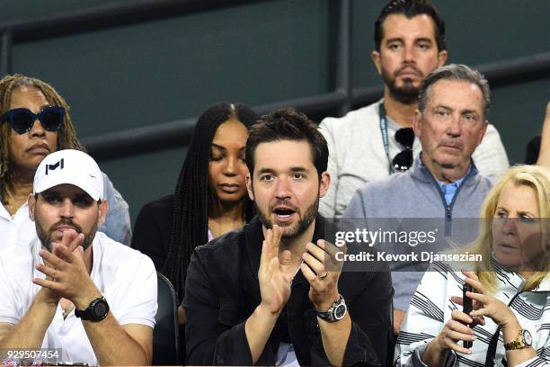 Alexis Ohanian, co-founder and executive chairman of the social news website Reddit, cheers for his wife Serena Williams as she battles against...