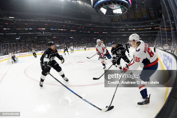 Jake Muzzin of the Los Angeles Kings battles for the puck against Andre Burakovsky of the Washington Capitals at STAPLES Center on March 8, 2018 in...