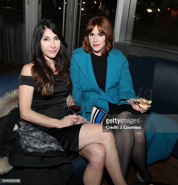 Actors Jamie Karen and Molly Ringwald pose for a photo at the screening of "Love, Simon" hosted by 20th Century Fox & Wingman at The Landmark at 57...