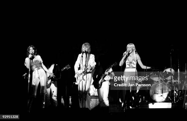 Anni-Frid Lyngstad, Bjorn Ulvaeus and Agnetha Faltskog of Swedish pop group ABBA perform on stage at the Brondbyhallen on January 31,1977 in...