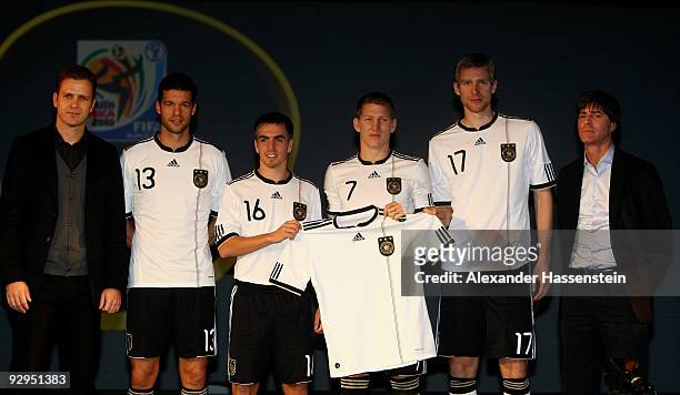 Manager Oliver Bierhoff, Michael Ballack, Philipp Lahm, Bastian Schweinsteiger, Per Mertesacker and head coach Joachim Loew present the new German...