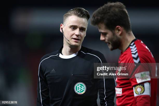 Referee Steffen Bruetting reacts during the 3. Liga match between Karlsruher SC and SG Sonnenhof Grossaspach at on March 07, 2018 in Karlsruhe,...